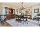Dining room with hardwood floors, large china cabinet, and elegant lighting at 2111 Broadfield Run, Duluth, GA 30097