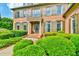 Elegant brick home with a landscaped front yard and a charming balcony creating a picturesque curb appeal at 2111 Broadfield Run, Duluth, GA 30097