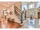 Grand foyer features a staircase, high ceilings, and hardwood floors at 2111 Broadfield Run, Duluth, GA 30097
