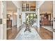 Grand foyer with hardwood floors, high ceilings, decorative rug, and elegant staircase at 2111 Broadfield Run, Duluth, GA 30097