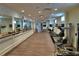 Spacious gym with wood floors, mirrors, and a variety of equipment for exercise at 2111 Broadfield Run, Duluth, GA 30097