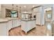 Bright kitchen showcasing an island, granite counters, and stainless steel appliances at 2111 Broadfield Run, Duluth, GA 30097