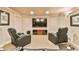 A well-designed living room features two comfortable leather recliners facing a large flat-screen television at 2111 Broadfield Run, Duluth, GA 30097