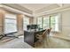 Bright office with large windows, crown molding, neutral tones, and a functional desk setup for productivity at 2111 Broadfield Run, Duluth, GA 30097