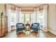 A sitting room featuring a set of chairs and large windows at 2111 Broadfield Run, Duluth, GA 30097