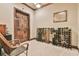 A wine cellar displays bottles of wine and vintage furniture in this luxury house at 2111 Broadfield Run, Duluth, GA 30097