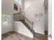 Foyer features hardwood floors, staircase with wooden railings, and plenty of natural light at 275 Creek View Pl, Canton, GA 30114