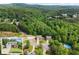 Aerial view showcases lush green canopy and highlights the property's landscape at 275 Creek View Place, Canton, GA 30114