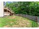 Backyard featuring a gentle slope and a wooden fence at the back of the property at 275 Creek View Place, Canton, GA 30114