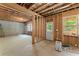 Unfinished basement ready to be customized, featuring a concrete floor and natural light from windows at 275 Creek View Place, Canton, GA 30114