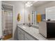 Bathroom featuring a white vanity with granite countertop, a decorative mirror, and a separate toilet room at 275 Creek View Place, Canton, GA 30114
