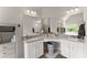 Spacious bathroom featuring double sinks with granite countertops, decorative mirrors, and vanity space at 275 Creek View Place, Canton, GA 30114