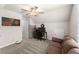 Bonus room with a ceiling fan, desk, sofa, and space for a variety of activities at 275 Creek View Place, Canton, GA 30114