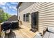 A wooden deck outside features outdoor furniture and a grill, with a view of backyard at 275 Creek View Place, Canton, GA 30114