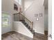 Bright entryway featuring soaring ceilings, wood flooring, and decorative wrought iron staircase at 275 Creek View Place, Canton, GA 30114