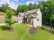 Stunning two-story home featuring an attached two car garage and beautifully landscaped yard with wooded backdrop at 275 Creek View Place, Canton, GA 30114