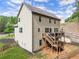Two-story home exterior showcasing the deck, stairs, backyard and back of house at 275 Creek View Place, Canton, GA 30114