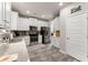 Modern kitchen with stainless steel appliances, white cabinets, granite countertops and a tile backsplash at 275 Creek View Place, Canton, GA 30114