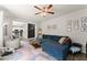 Bright living room featuring an open floorplan and a plush blue sectional sofa at 275 Creek View Place, Canton, GA 30114