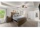 Serene main bedroom with tray ceiling, a king-size bed, and lots of natural light at 275 Creek View Place, Canton, GA 30114