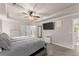 Spacious main bedroom with tray ceiling, carpeting, and an ensuite bathroom at 275 Creek View Place, Canton, GA 30114