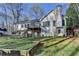 Expansive backyard with mature trees and a deck, ideal for outdoor gatherings and enjoying nature at 3075 Superior Dr, Dacula, GA 30019