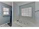 Bright bathroom featuring a tub and shower combination at 3075 Superior Dr, Dacula, GA 30019