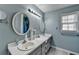 Bathroom featuring double sinks and plenty of vanity counter space at 3075 Superior Dr, Dacula, GA 30019