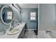 Bathroom featuring double sinks, white countertop and tub at 3075 Superior Dr, Dacula, GA 30019