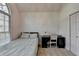 Bedroom with a large window for natural light, plus a desk and chair at 3075 Superior Dr, Dacula, GA 30019