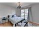 Light and airy bedroom with hardwood floors and large window at 3075 Superior Dr, Dacula, GA 30019