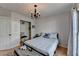 Well-lit bedroom featuring a closet, a door and a large window at 3075 Superior Dr, Dacula, GA 30019