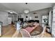 Elegant dining area with hardwood floors, stylish lighting, and seamless access to the living area at 3075 Superior Dr, Dacula, GA 30019