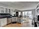 Spacious kitchen featuring stainless steel appliances, a dark countertop, and an eat-in dining area at 3075 Superior Dr, Dacula, GA 30019