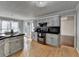 Well-appointed kitchen featuring painted cabinets, stainless steel appliances, and hardwood floors at 3075 Superior Dr, Dacula, GA 30019
