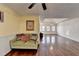 Bright living room featuring hardwood floors, stylish lighting, and neutral paint colors at 3075 Superior Dr, Dacula, GA 30019