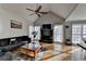 Stylish living room with vaulted ceiling, fireplace, large windows, and comfortable seating at 3075 Superior Dr, Dacula, GA 30019