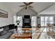 Inviting living room with a fireplace, TV, large windows, and comfortable seating at 3075 Superior Dr, Dacula, GA 30019