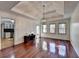 Open-concept living area featuring hardwood flooring and seamless flow into the dining and kitchen spaces at 3075 Superior Dr, Dacula, GA 30019
