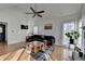 Bright living room featuring vaulted ceiling, fireplace, and large windows at 3075 Superior Dr, Dacula, GA 30019