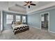 Spacious main bedroom with plush carpet and a trey ceiling at 3075 Superior Dr, Dacula, GA 30019