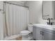 Clean bathroom featuring gray vanity with modern fixtures and a shower with a curtain at 3962 Coventry Park Ln, Peachtree Corners, GA 30096