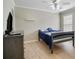 Nicely painted bedroom with modern ceiling fan, pale wood floors, and plenty of natural light at 3962 Coventry Park Ln, Peachtree Corners, GA 30096