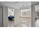 Hallway with view to bedrooms featuring hardwood floors, and nicely painted walls at 3962 Coventry Park Ln, Peachtree Corners, GA 30096