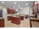 Open kitchen design with wooden cabinetry, granite countertops, an island, and stainless steel appliances at 3962 Coventry Park Ln, Peachtree Corners, GA 30096
