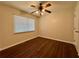 Bedroom featuring wood-look flooring, a ceiling fan, and natural light at 485 Angham Rd, Hiram, GA 30141