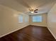 Bedroom with wood-look flooring, ceiling fan, and natural light at 485 Angham Rd, Hiram, GA 30141