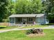Charming one-story home with a rocking chair front porch and inviting curb appeal at 485 Angham Rd, Hiram, GA 30141