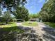Sprawling front yard with circular driveway and carport enhances this lovely home's exterior at 485 Angham Rd, Hiram, GA 30141
