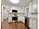 Bright kitchen with stainless steel appliances, white cabinets and subway tile backsplash at 485 Angham Rd, Hiram, GA 30141